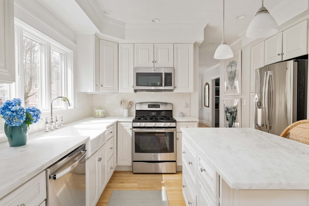 106 Florence Avenue Arlington, MA 02476 - Photo 4 of 34 a kitchen with a sink stove and refrigerator