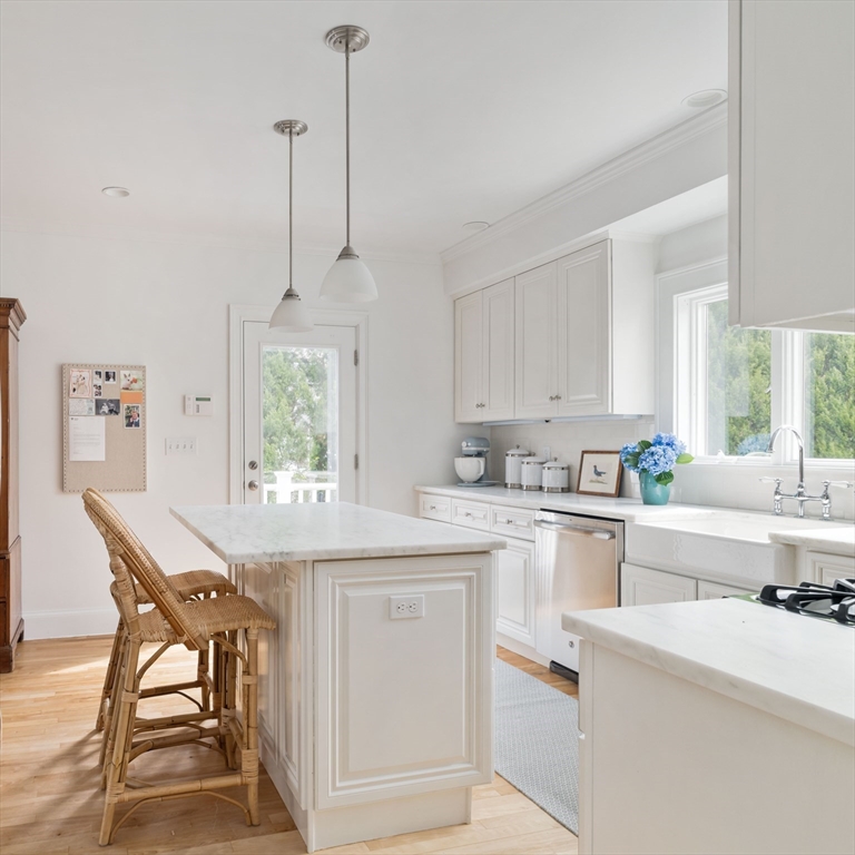 106 Florence Avenue Arlington, MA 02476 - Photo 5 of 34 a kitchen with appliances cabinets and chair