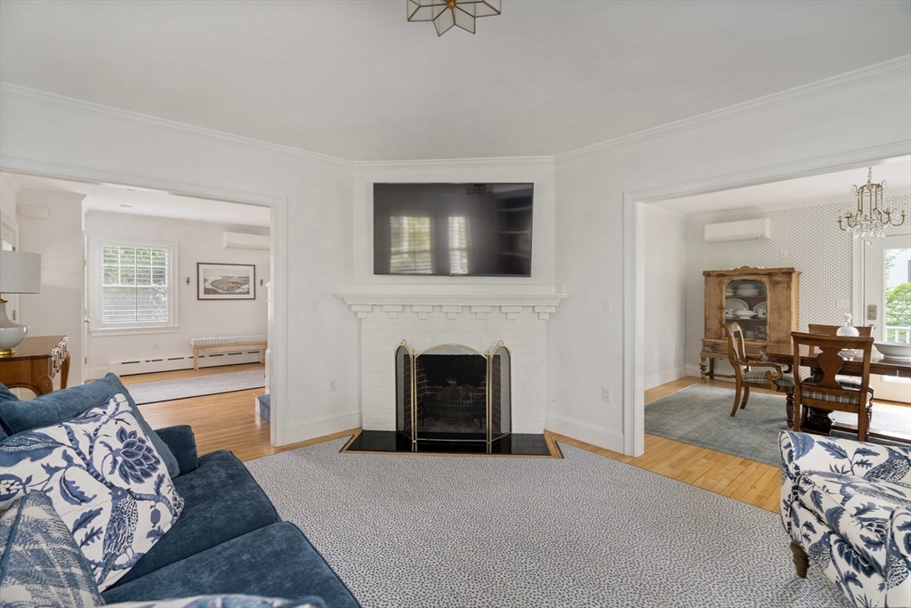 106 Florence Avenue Arlington, MA 02476 - Photo 9 of 34 a living room with furniture and a fireplace