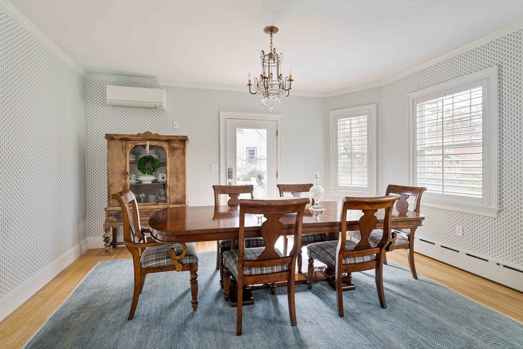 106 Florence Avenue Arlington, MA 02476 - Photo 10 of 34 a view of a dining room with furniture window and wooden floor