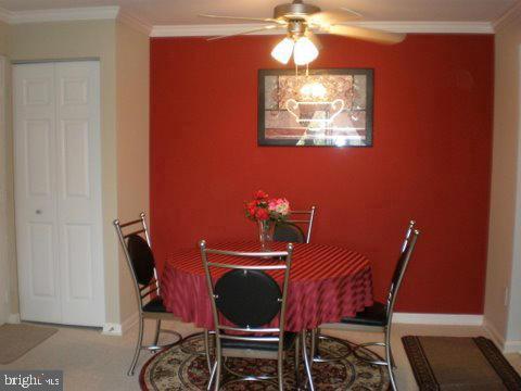14800 Rydell Road, Unit 202 Centreville, VA 20121 - Photo 4 of 10 a view of a dining room with furniture and chandelier