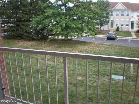 14800 Rydell Road, Unit 202 Centreville, VA 20121 - Photo 10 of 10 a view of a house with backyard and sitting area