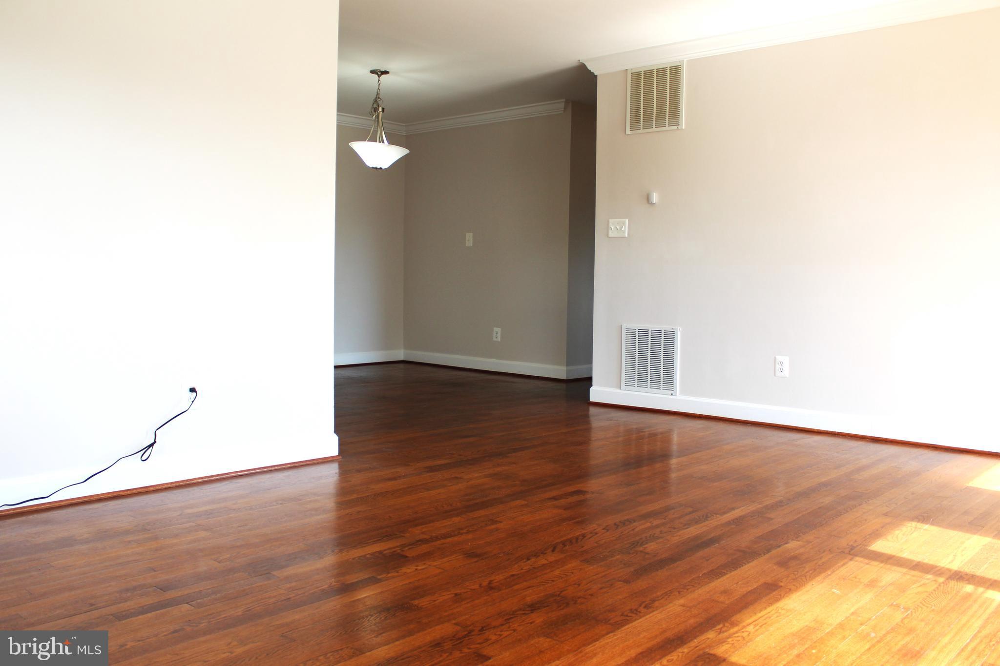 908 Vanderwood Road Catonsville, MD 21228 - Photo 19 of 36 a view of a room with wooden floor