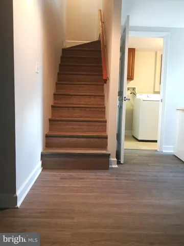 a view of entryway with wooden floor