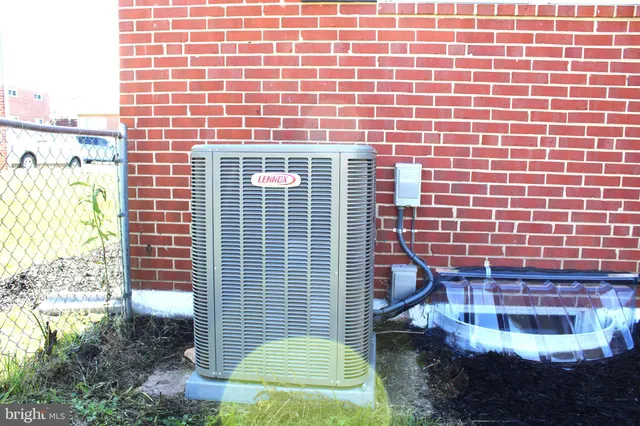 a view of a brick building next to a yard