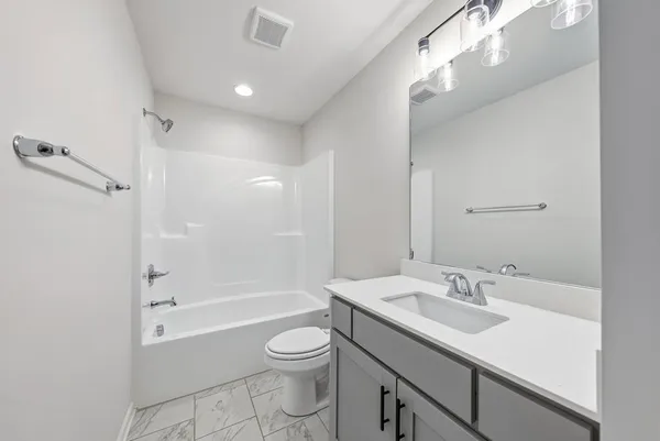 a bathroom with a shower and bathtub
