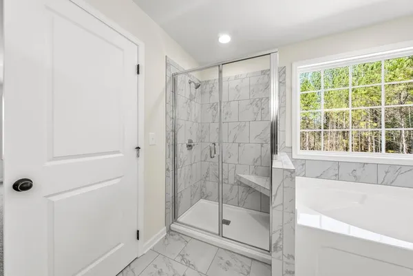 a bathroom with double sink and a mirror