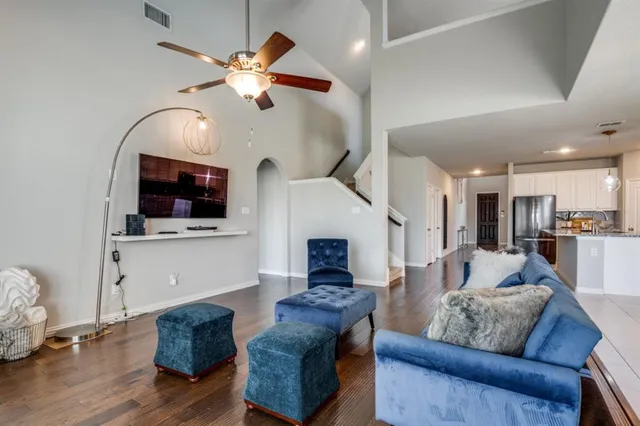 a living room with furniture fireplace and flat screen tv