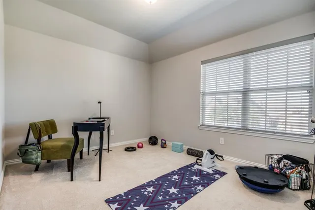 a bedroom with furniture and a window