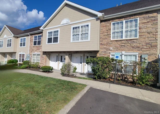 a front view of a house with a yard and porch