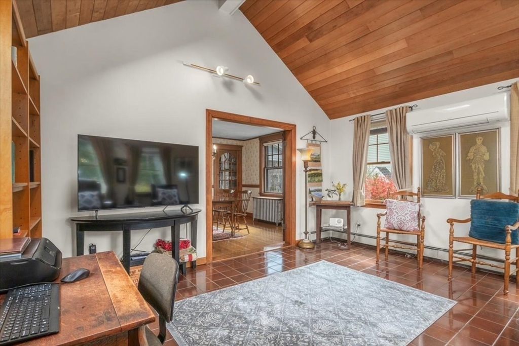 62 Washington Avenue Needham, MA 02492 - Photo 12 of 42 a living room with furniture and a flat screen tv