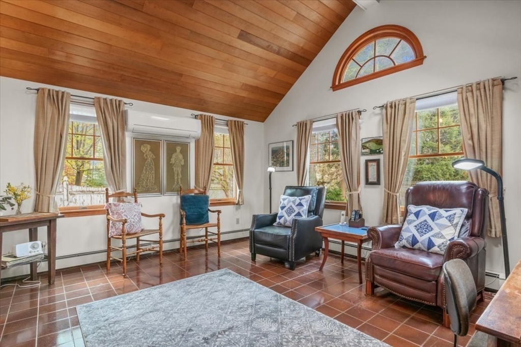 62 Washington Avenue Needham, MA 02492 - Photo 13 of 42 a living room with furniture a wooden floor and a large window