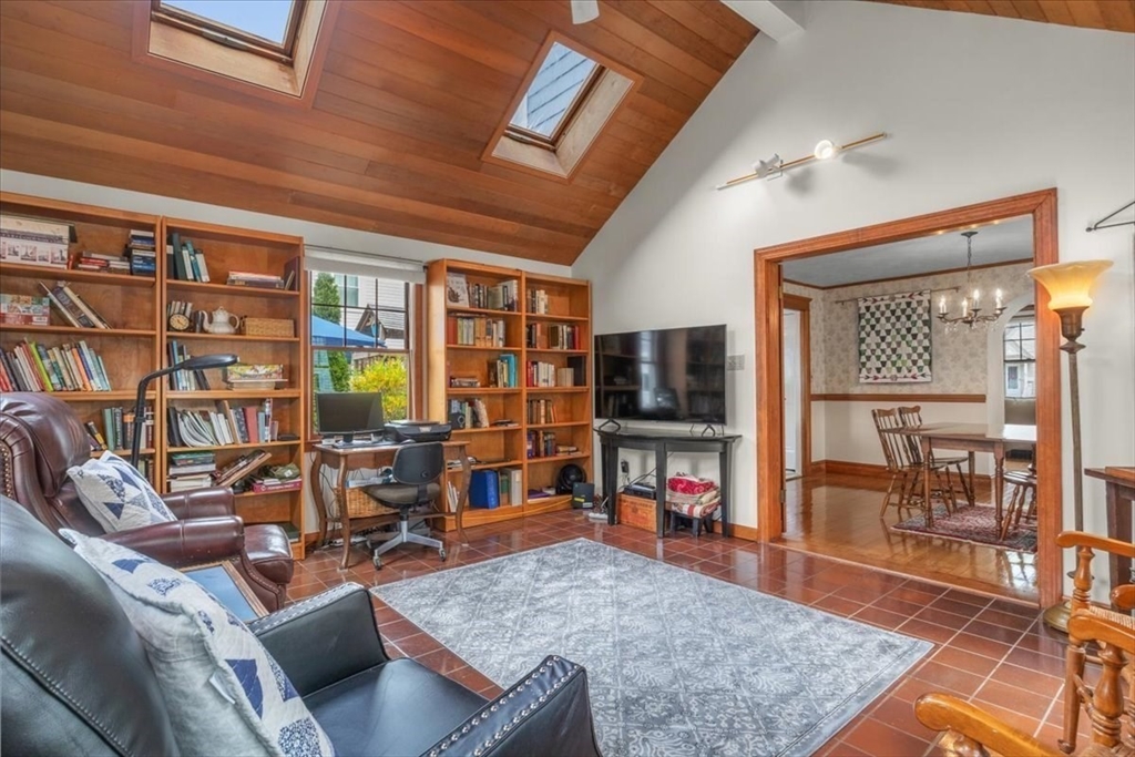 62 Washington Avenue Needham, MA 02492 - Photo 14 of 42 a living room with furniture and a flat screen tv