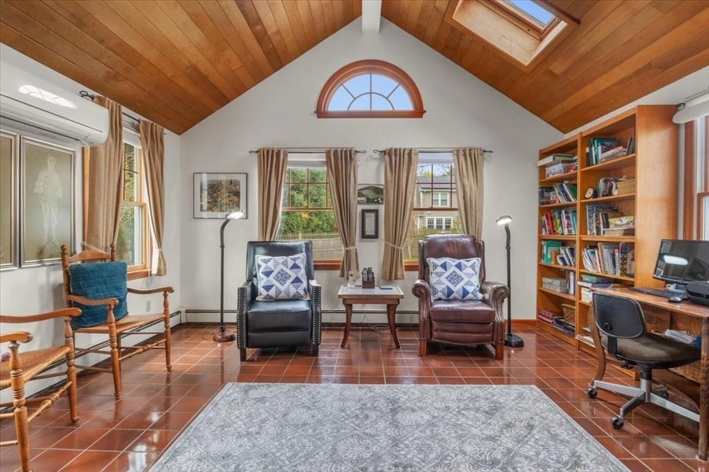 62 Washington Avenue Needham, MA 02492 - Photo 15 of 42 a living room with furniture a rug and a large window