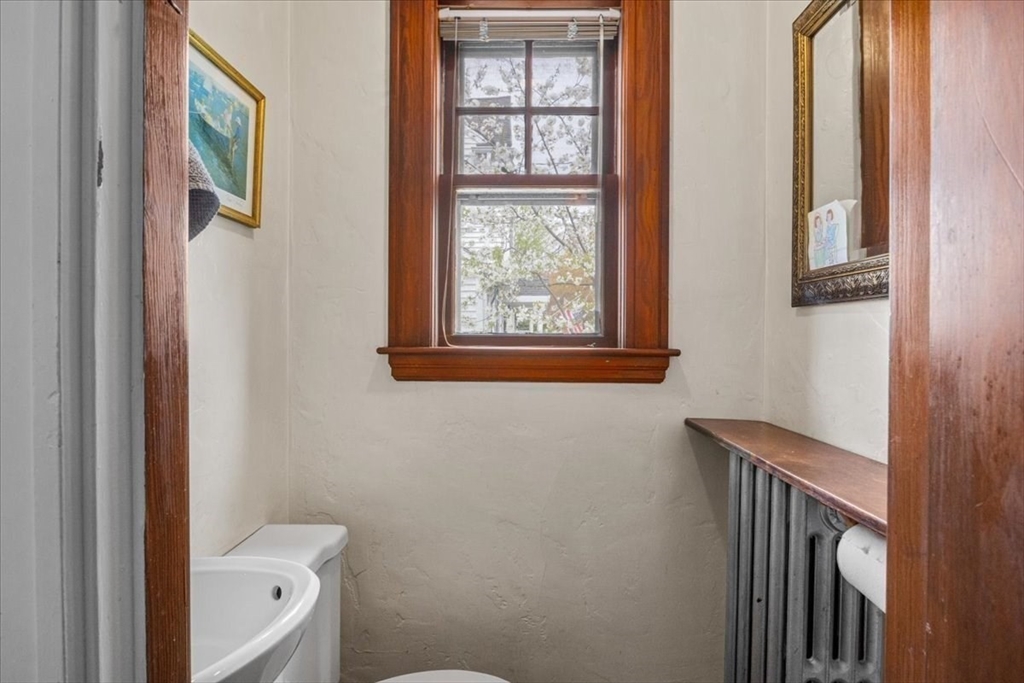 62 Washington Avenue Needham, MA 02492 - Photo 20 of 42 a bathroom with a toilet a sink and a window