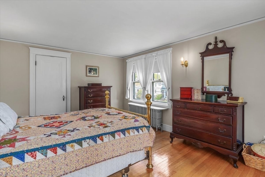 62 Washington Avenue Needham, MA 02492 - Photo 23 of 42 a bedroom with a bed and a dresser
