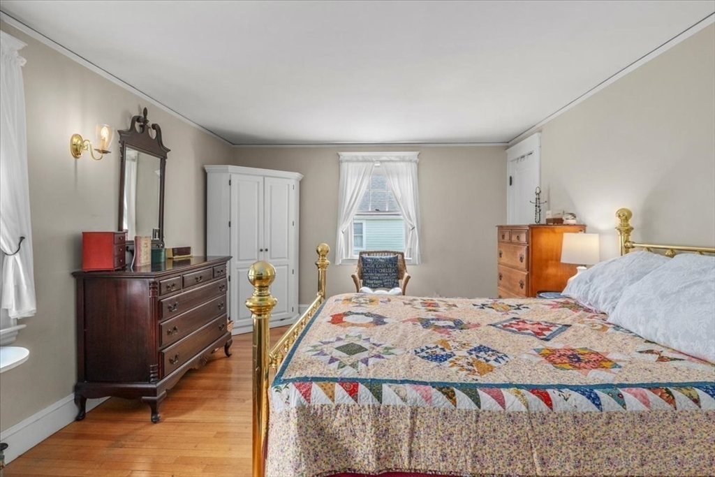 62 Washington Avenue Needham, MA 02492 - Photo 24 of 42 a bedroom with a bed and dresser