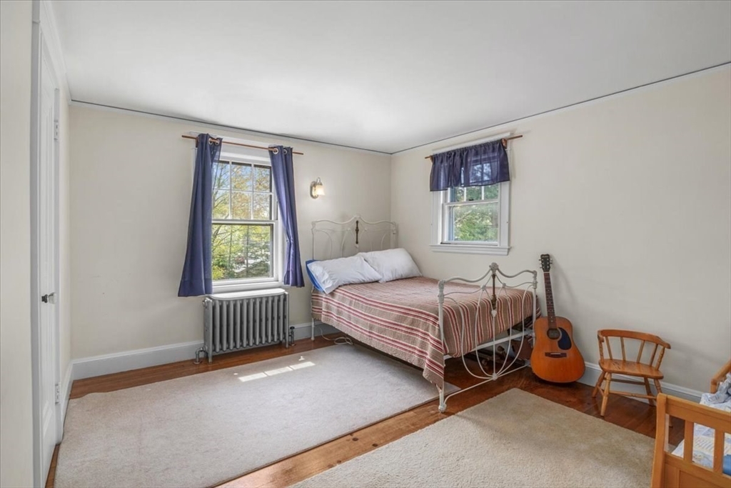 62 Washington Avenue Needham, MA 02492 - Photo 25 of 42 a bedroom with a bed and a window