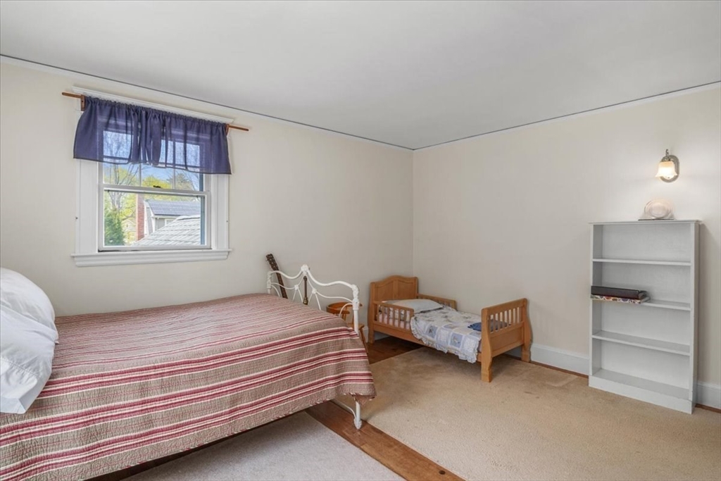 62 Washington Avenue Needham, MA 02492 - Photo 26 of 42 a bedroom with a bed and a window