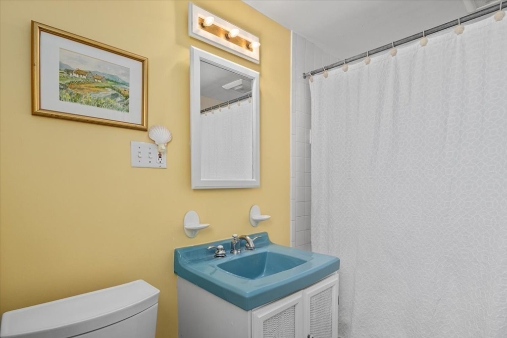 62 Washington Avenue Needham, MA 02492 - Photo 29 of 42 a bathroom with a sink and a toilet