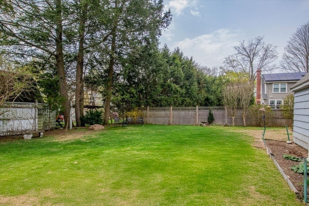 62 Washington Avenue Needham, MA 02492 - Photo 31 of 42 a view of a backyard with a garden