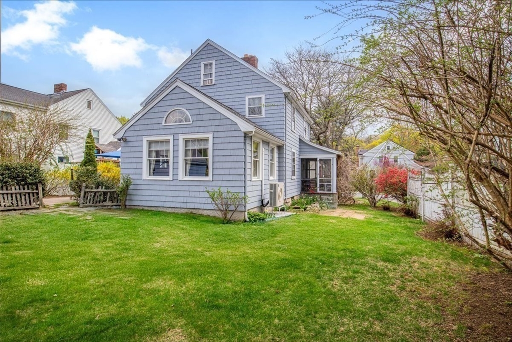 62 Washington Avenue Needham, MA 02492 - Photo 32 of 42 a front view of a house with a garden