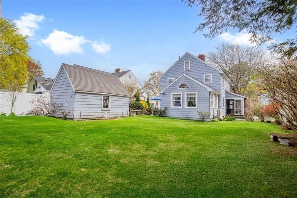 62 Washington Avenue Needham, MA 02492 - Photo 33 of 42 a front view of a house with a yard