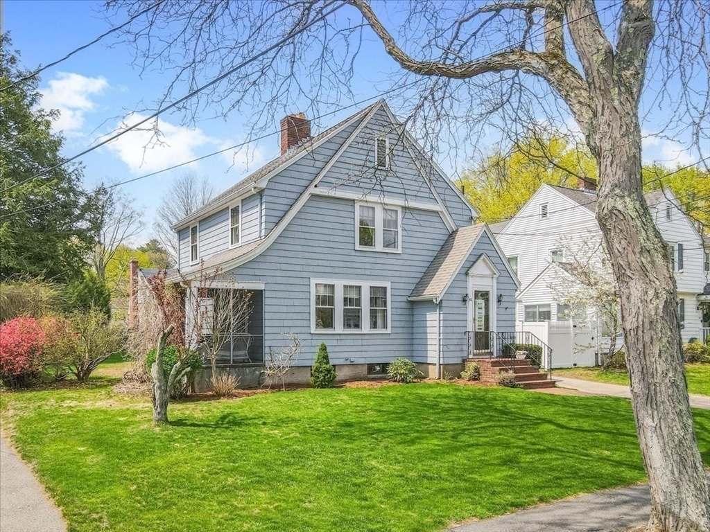 62 Washington Avenue Needham, MA 02492 - Photo 35 of 42 a front view of house with yard and green space