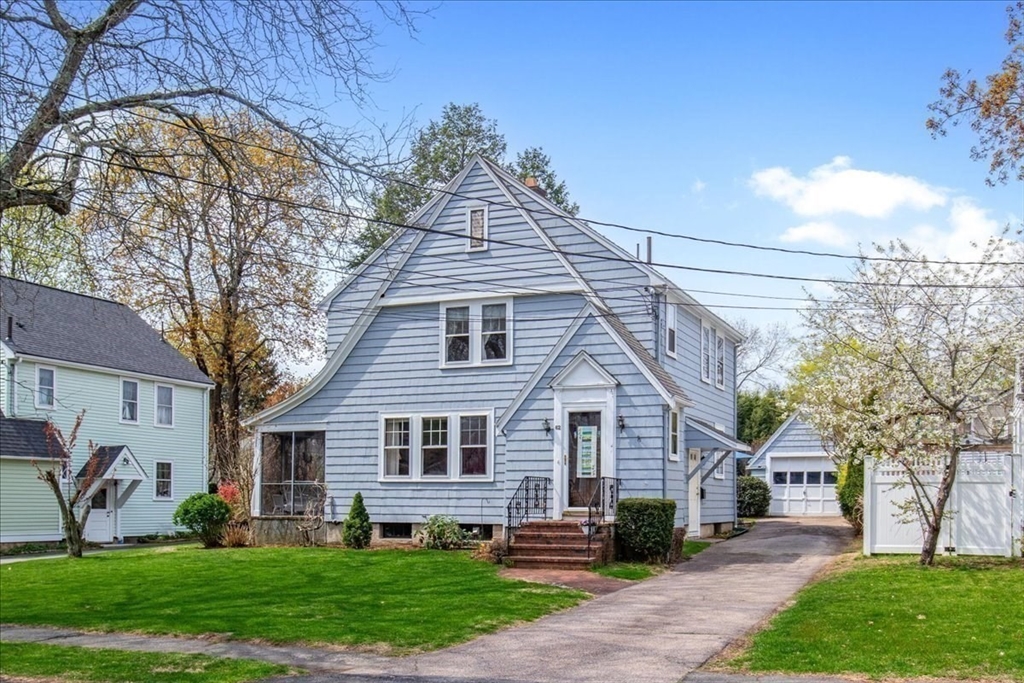 62 Washington Avenue Needham, MA 02492 - Photo 37 of 42 a front view of a house with a yard