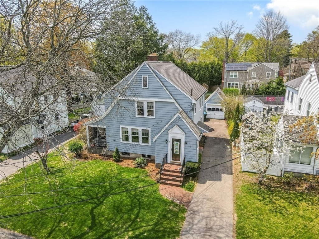 62 Washington Avenue Needham, MA 02492 - Photo 38 of 42 a front view of a house with a yard