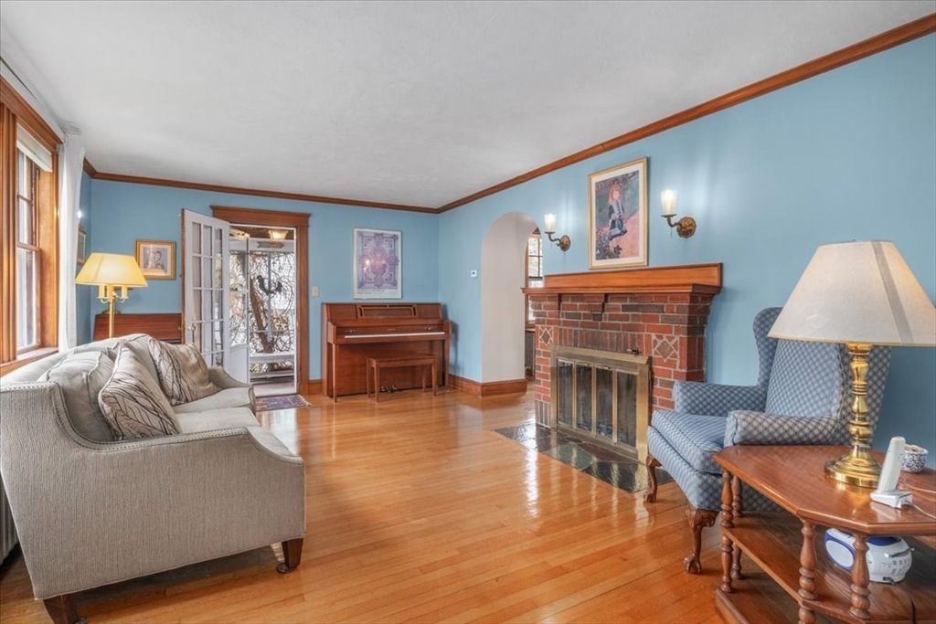 62 Washington Avenue Needham, MA 02492 - Photo 6 of 42 a living room with furniture and a fireplace