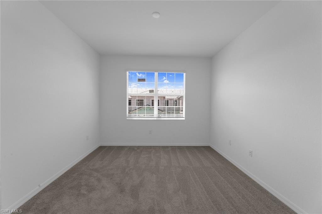 2856 Citrus Street Naples, FL 34120 - Photo 14 of 20 Spare room featuring carpet flooring and baseboards