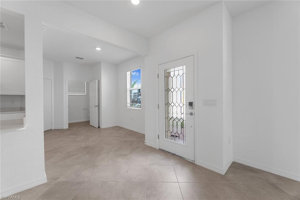 2856 Citrus Street Naples, FL 34120 - Photo 2 of 20 Foyer with baseboards and recessed lighting