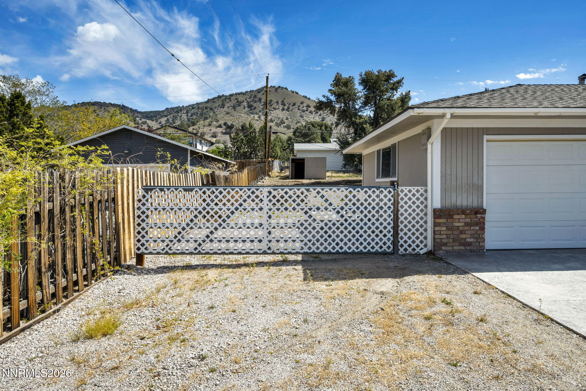 14190 Rim Rock Drive Reno, NV 89521 - Photo 27 of 68 a view of a house with wooden fence