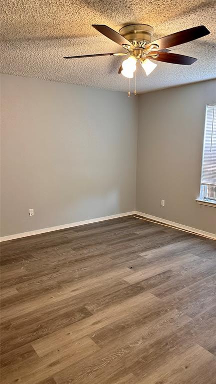 3812 Stuart Road Denton, TX 76209 - Photo 8 of 9 a view of a room with wooden floor and fan