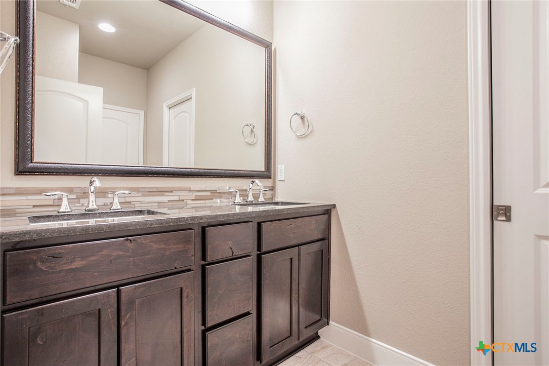 549 Wills Point Way Belton, TX 76513 - Photo 26 of 31 a bathroom with a sink and a mirror