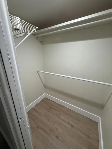a view of an empty walk in closet