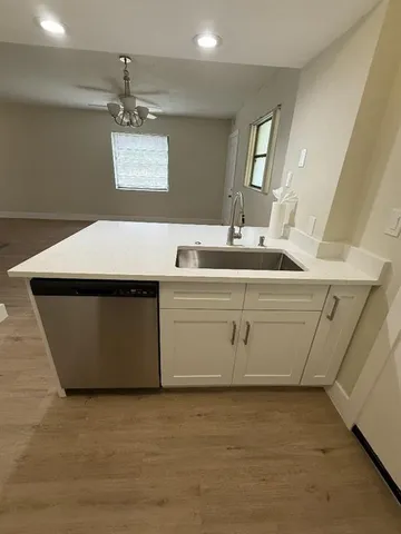 a utility room with a sink washer and dryer