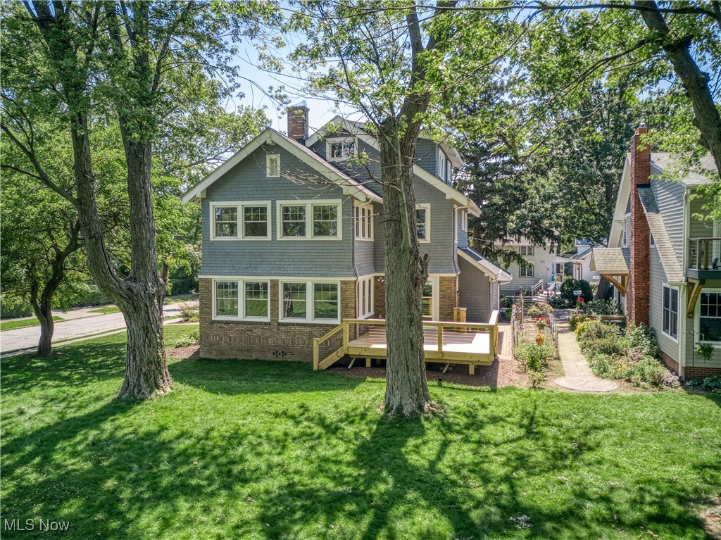 17728 Windward Road Cleveland, OH 44119 - Photo 5 of 32 Back of house with a lawn and a wooden deck