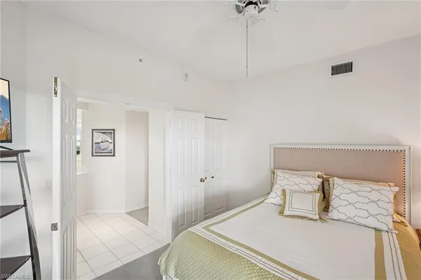 a bedroom with a bed and a table