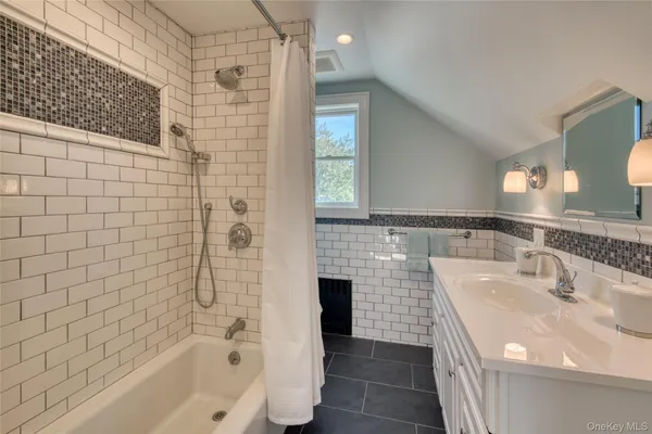 a bathroom with a sink and a bathtub