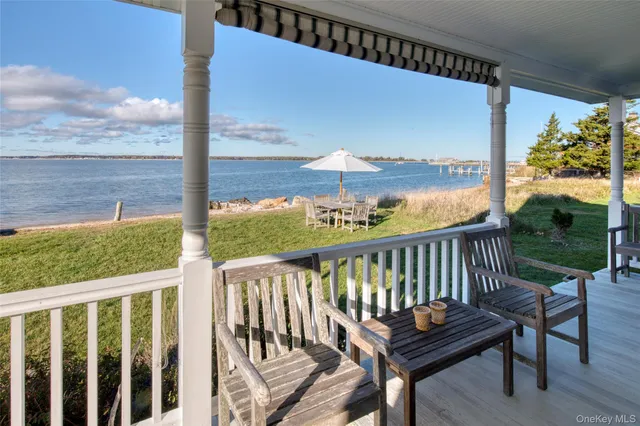 a view of a two chairs in the balcony