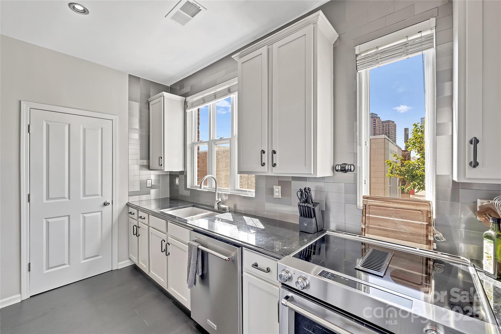 1425 Camden Road Charlotte, NC 28203 - Photo 13 of 37 a kitchen that has a sink and a stove