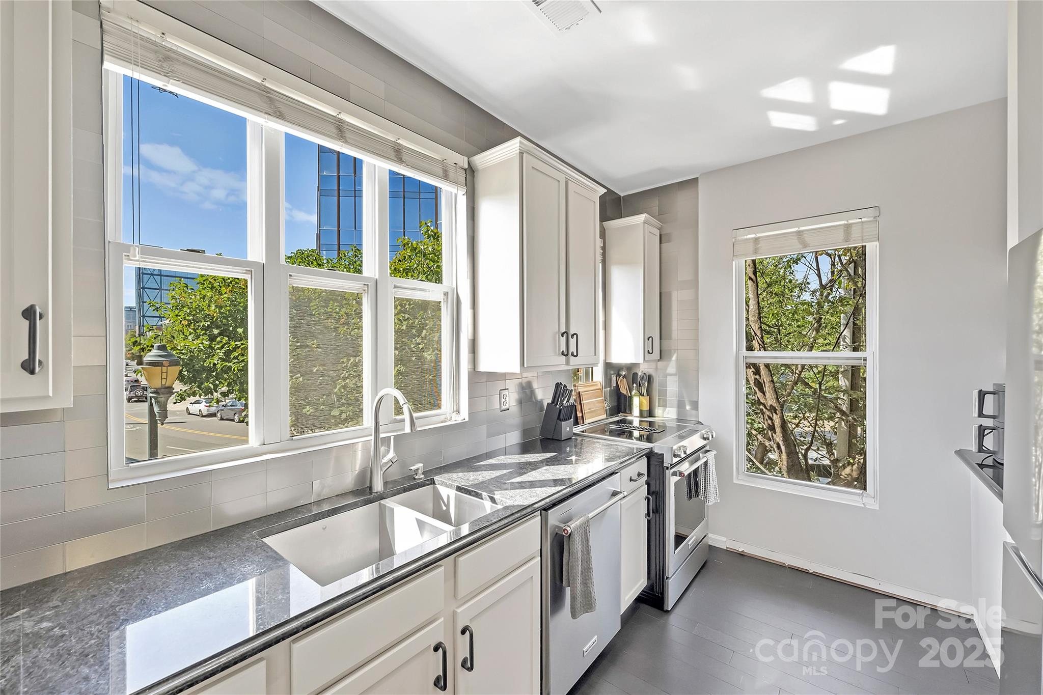 1425 Camden Road Charlotte, NC 28203 - Photo 14 of 37 a view of a kitchen with a sink and large window