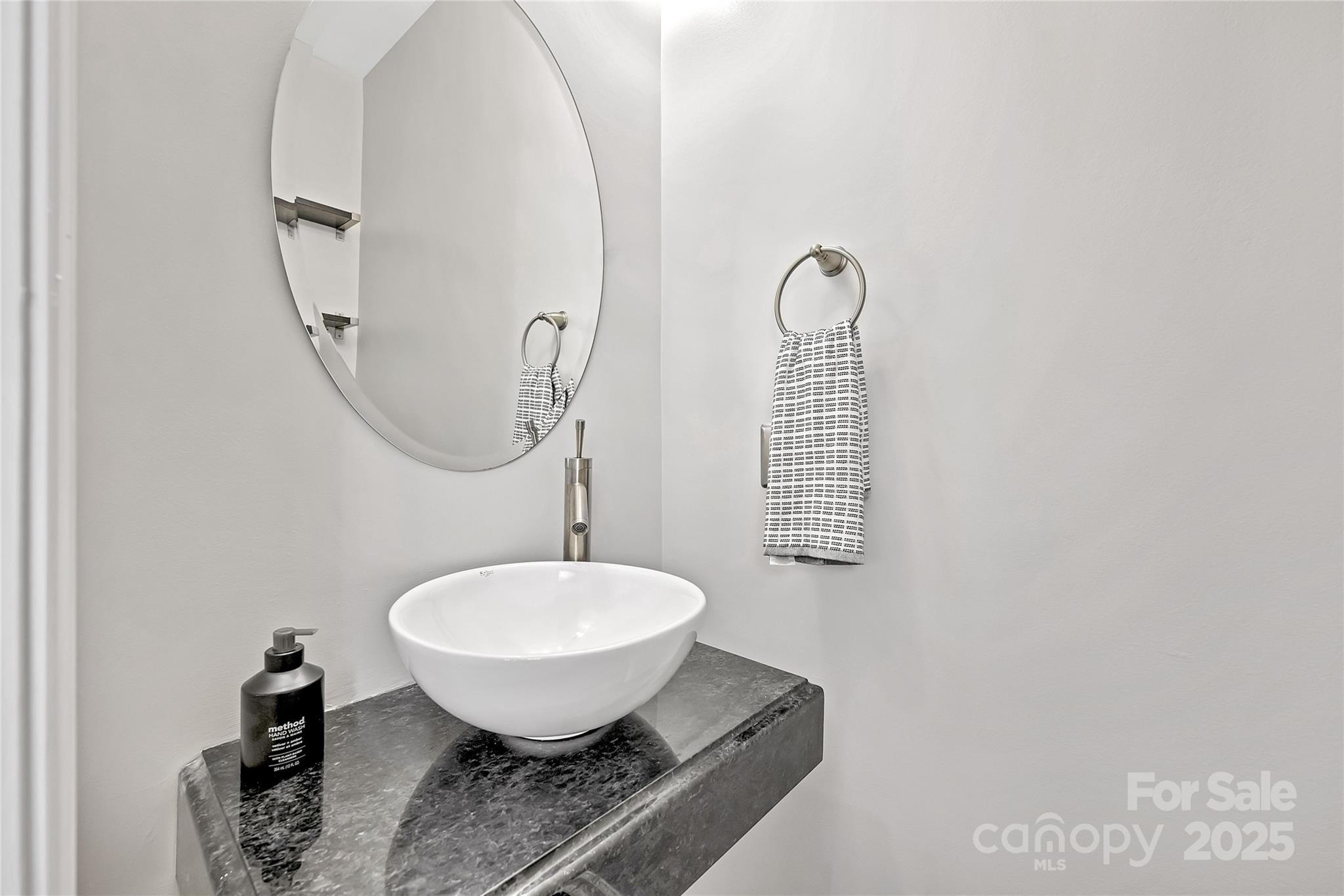 1425 Camden Road Charlotte, NC 28203 - Photo 16 of 37 a bathroom with a toilet sink and mirror