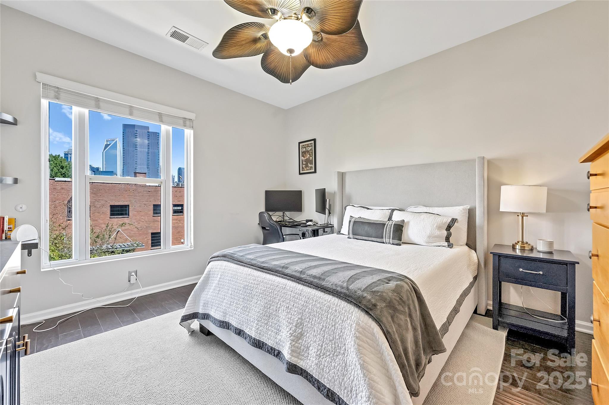 1425 Camden Road Charlotte, NC 28203 - Photo 18 of 37 a spacious bedroom with a bed and a chandelier