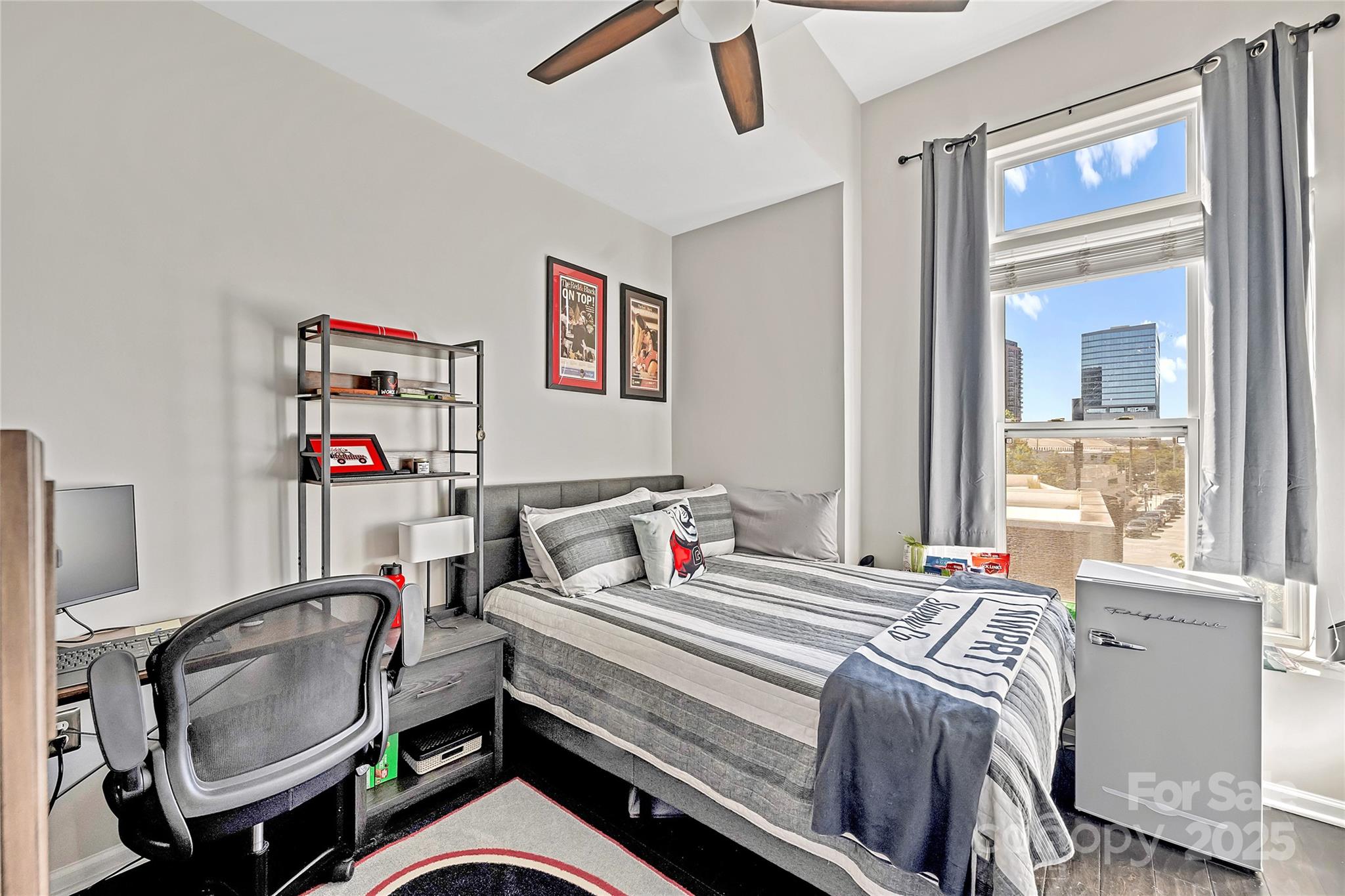 1425 Camden Road Charlotte, NC 28203 - Photo 23 of 37 a bed room with a bed and a chair