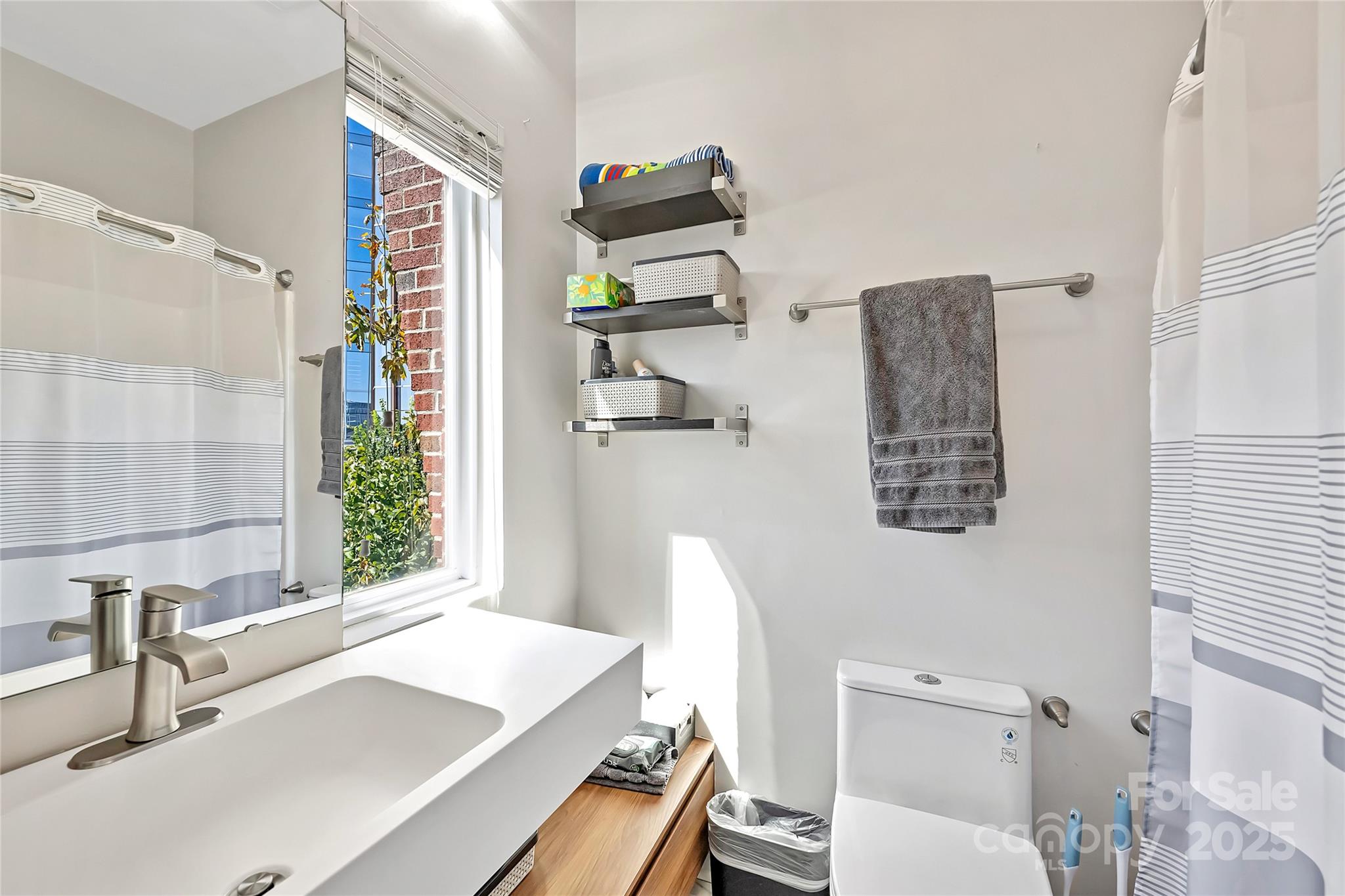 1425 Camden Road Charlotte, NC 28203 - Photo 24 of 37 a bathroom with a sink a toilet and a bathtub