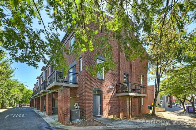 a view of a house with a tree