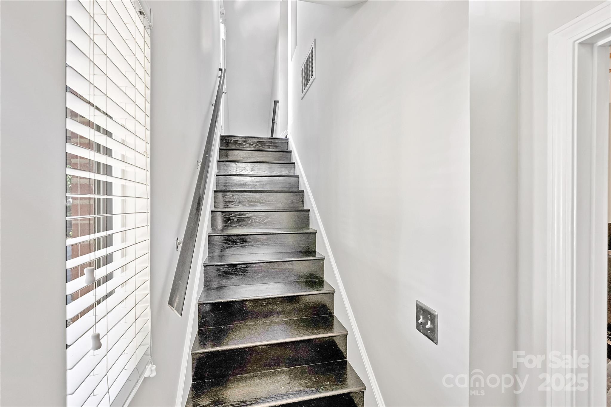 1425 Camden Road Charlotte, NC 28203 - Photo 3 of 37 a view of staircase with white walls and a window